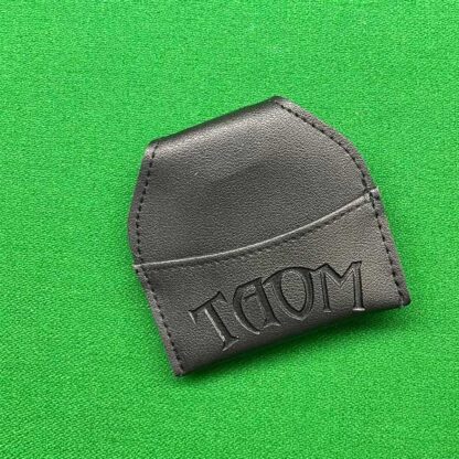 Taom Black Chalk Bag attached to a belt, holding a piece of chalk